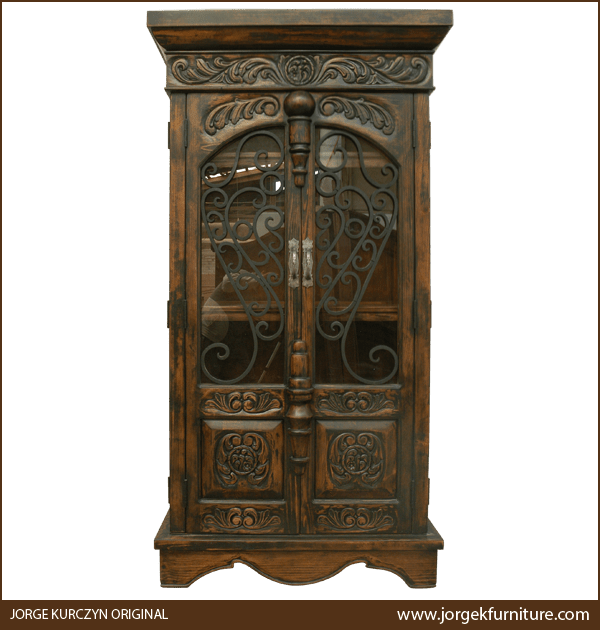 Front view of Martina Spanish colonial armoire with ornamental ironwork and carved panels