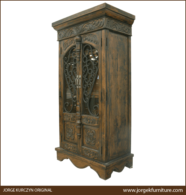 Three-quarter angle of Martina armoire showing curved apron and antique finish