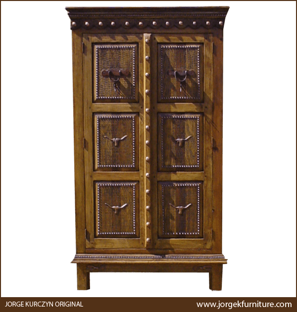 Front view of Rio Pecas armoire with copper spurs, bull heads, and staggered crown molding