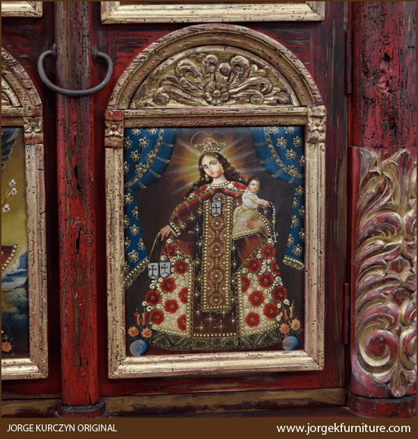 Close-up of Zoila-Elisa armoire’s top molding and Peruvian oil paintings