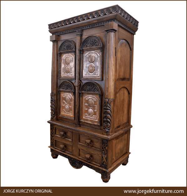 Three-quarter angle of Zoila-Elisa II armoire showing floral carvings and iron ring detail