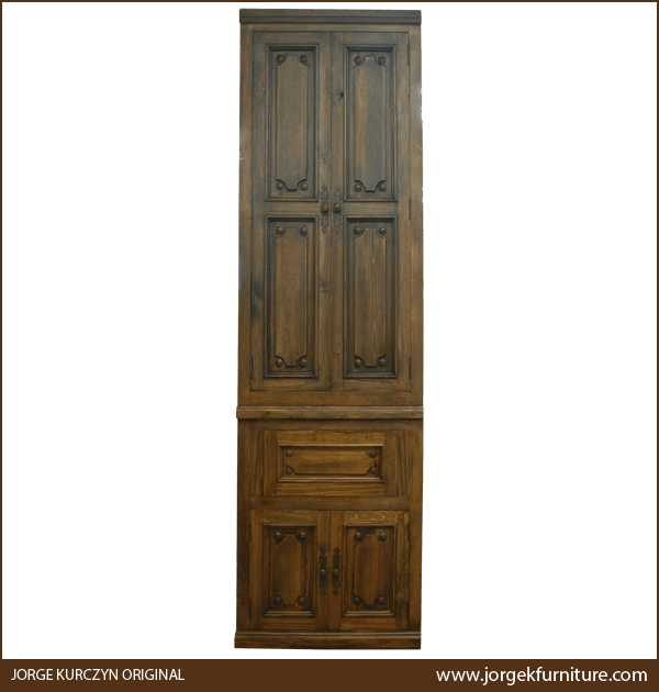 Front view of Rustico armoire with geometric panels and iron conchos