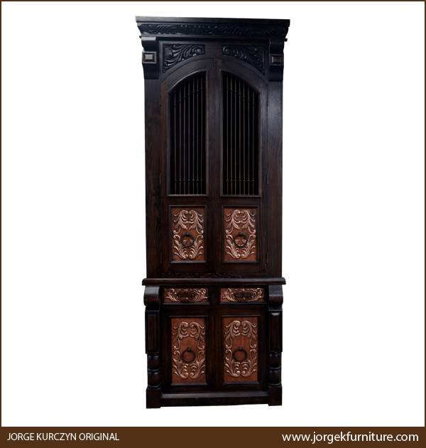 Front view of Spanish colonial armoire with copper panels and carved floral details