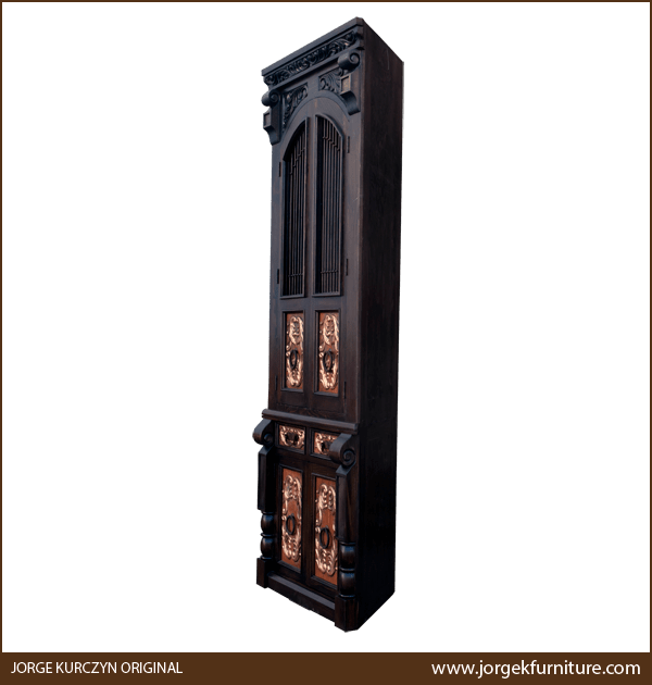 Three-quarter angle of Spanish colonial armoire showing carved crown and copper drawers