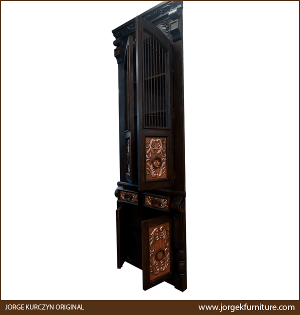 Spanish colonial armoire with doors ajar showing partial interior and copper panels