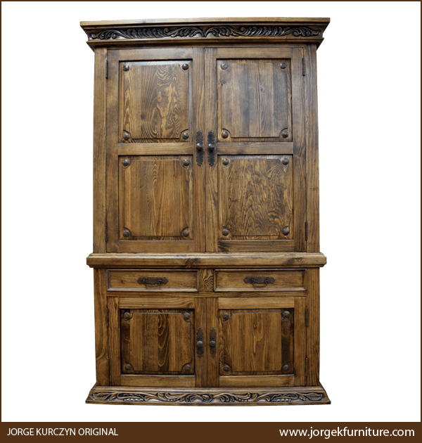 Front view of Spanish Colonial Armoire with iron conchos and carved floral crown