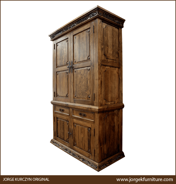 Three-quarter angle of Spanish Colonial Armoire showing carved base and iron handles