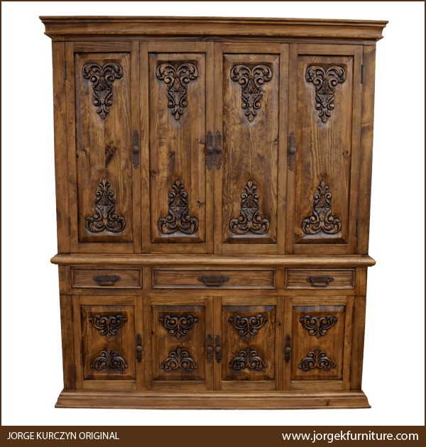 Front view of Spanish Colonial Storage Armoire with staggered crown and carved floral panels