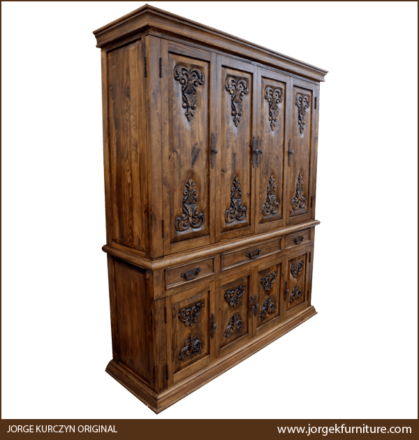 Three-quarter angle of Spanish Colonial Storage Armoire showing carved details and drawer layout