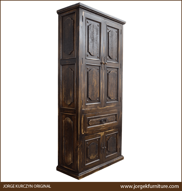 Three-quarter angle of Spanish Colonial Armoire showing carved details and molding base