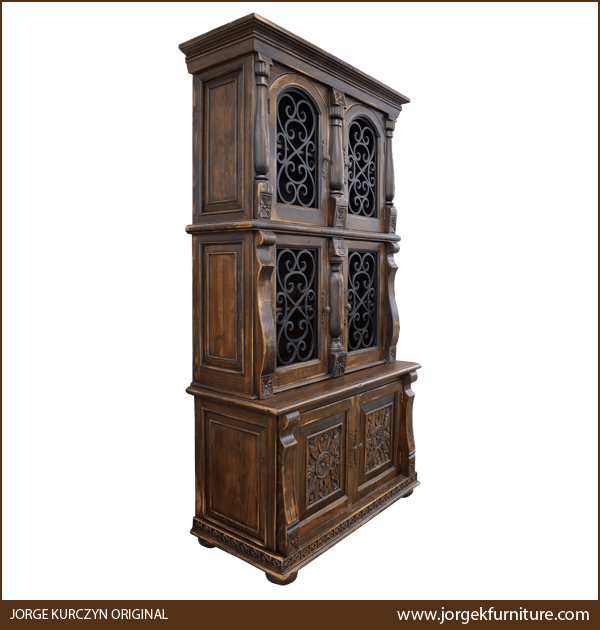 Three-quarter view of Spanish Colonial Armoire showing upper cabinet and lower carved base