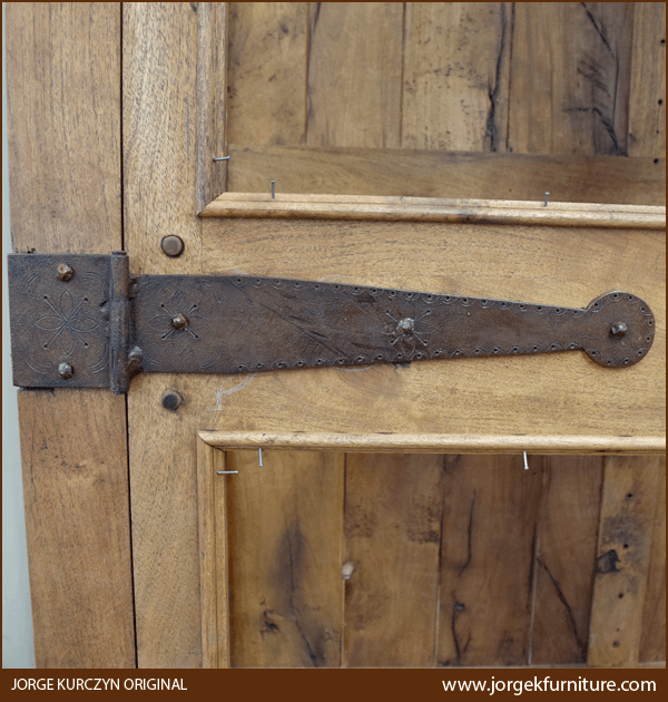 Close-up of hand forged iron hinge on Spanish Colonial Armoire door