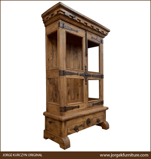 Three-quarter angle of Spanish Colonial Armoire showing carved molding and curved feet