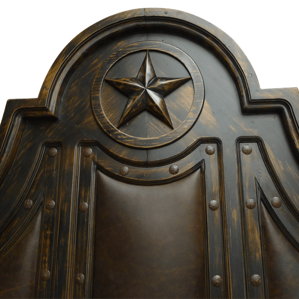 Detail of Texas Lone Star carving on headboard crest with scrollwork and iron accents