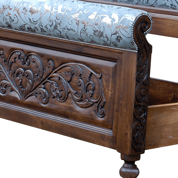 Detail of footboard carvings and turquoise patterned leather on Spanish colonial bed