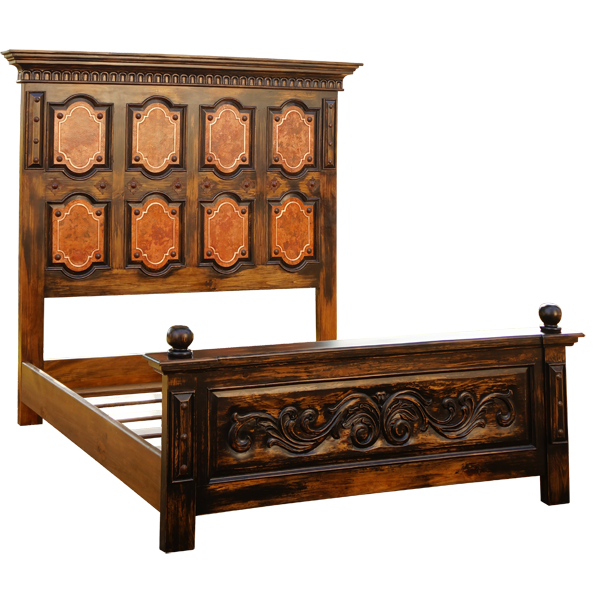 Semi-front view of Spanish colonial bed with copper panels and carved footboard details
