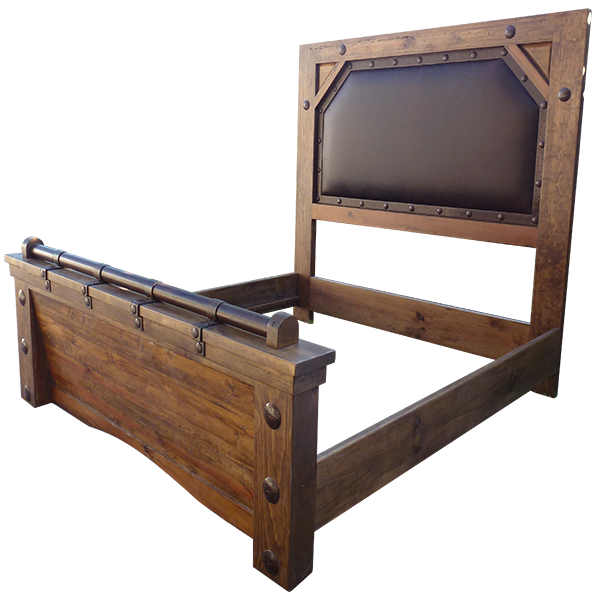 Semi-front view of Western-style bed with brown leather panel and forged iron conchos