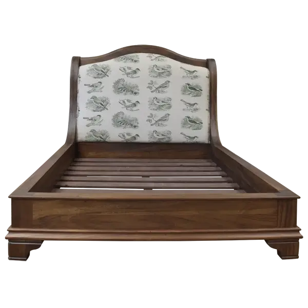 Front view of Spanish colonial bed with patterned upholstered headboard and Spanish brown finish