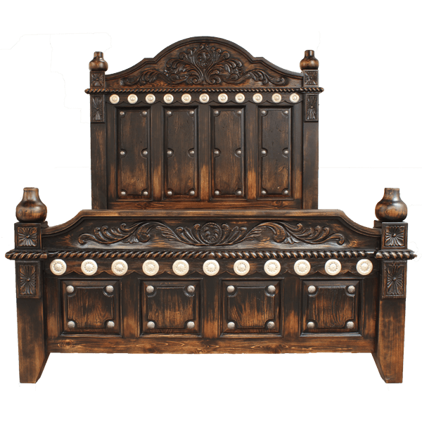 Front view of Spanish colonial bed with rectangular panels and silver conchos