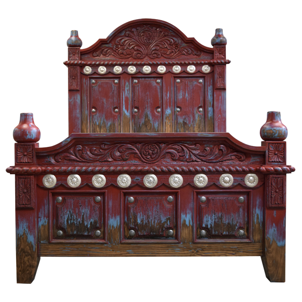 Front view of Spanish colonial bed with red distressed finish, silver copper conchos, and floral carving
