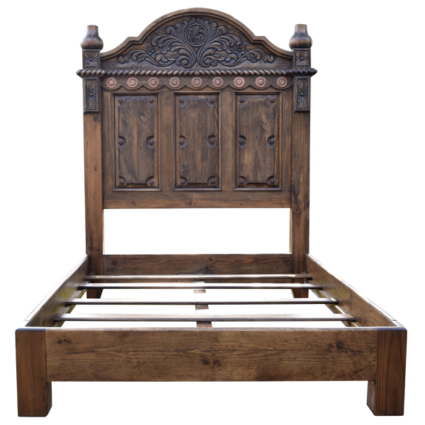 Front view of Spanish colonial bed with copper conchos and twist rope carving