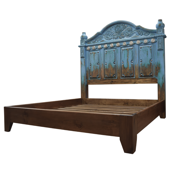Semi-front view of Spanish colonial bed with antique turquoise finish and copper details