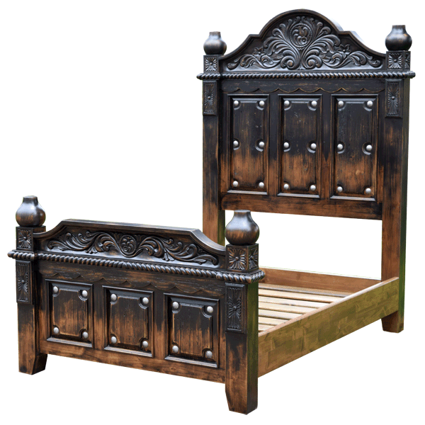 Semi-front view of Spanish colonial bed with floral scroll carving and copper details
