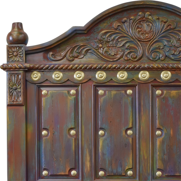 Detail of headboard with multicolor stain and golden copper conchos