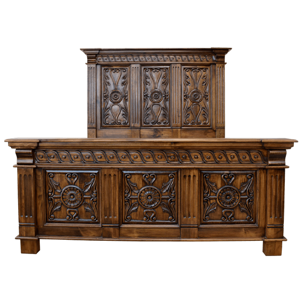 Front view of Spanish colonial bed with floral and geometric panels and fluted uprights