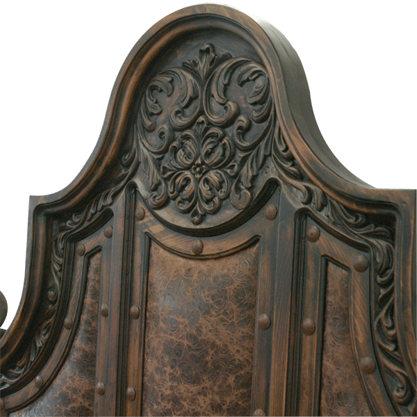 Detail of headboard floral scroll carving and rounded crest with carved wood sphere
