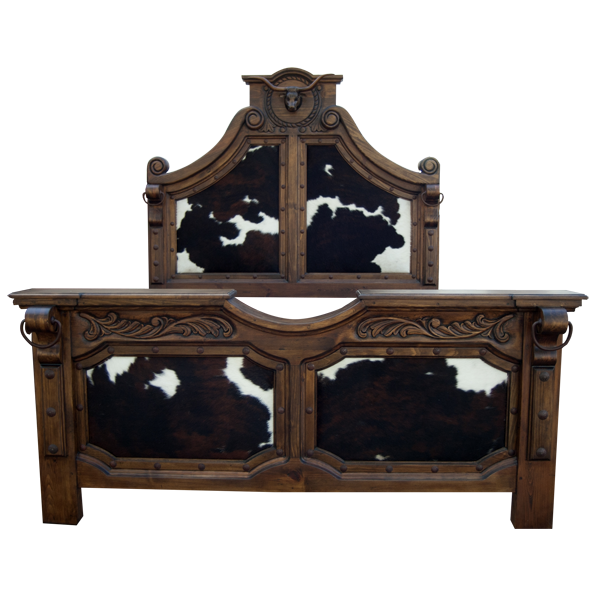 Front view of Western-style bed with bull crest and natural cowhide panels