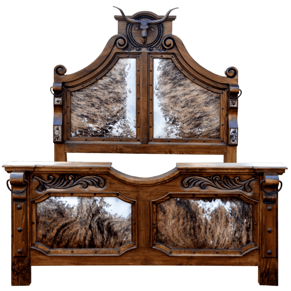 Front view of Western-style bed with bull crest, cowhide panels, and scroll carving