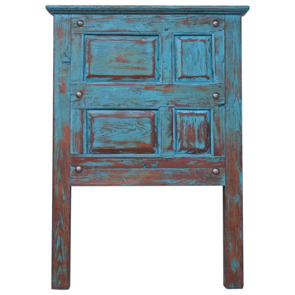 Front view of Western-style headboard made from reclaimed door with turquoise finish and iron conchos