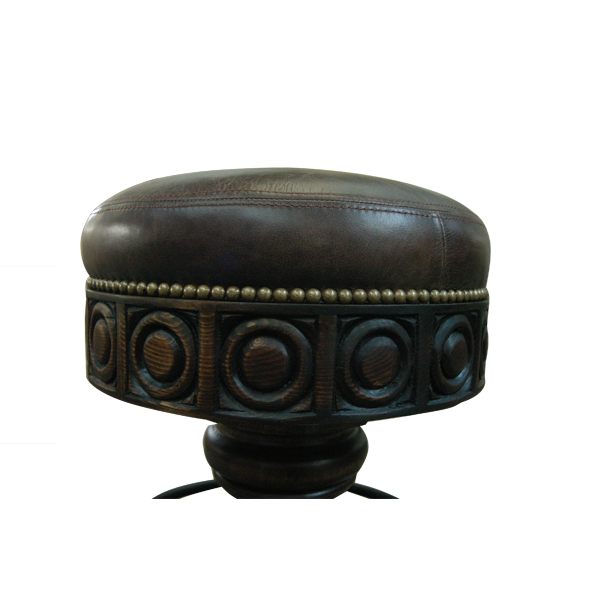 Close-up of El Matador Bajo 4 seat showing smooth leather and intricate carved wood detailing