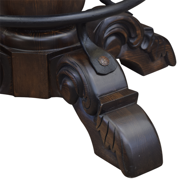 Close-up of hand-carved leg of El Matador Bajo 9 bar stool with dark brown stain