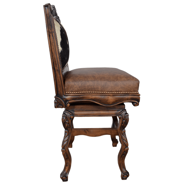 Side view of El Picador 7 chair with cowhide front panel and carved armrest
