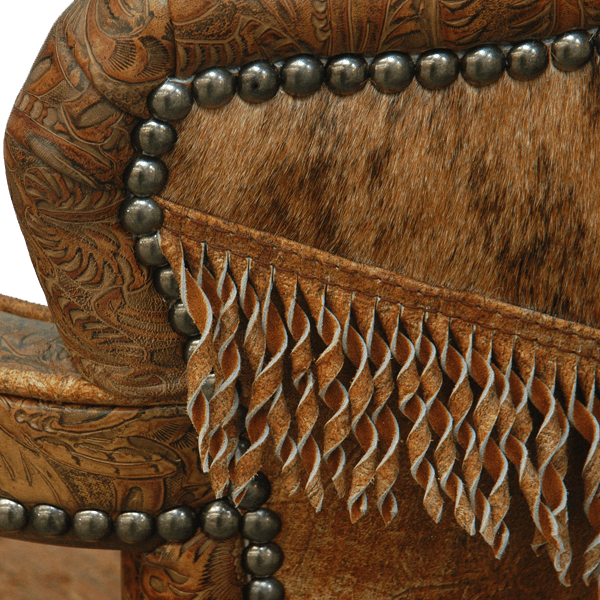 Detail view of Cowboy II bar stool showing embossed leather, decorative nails, cowhide, and fringe