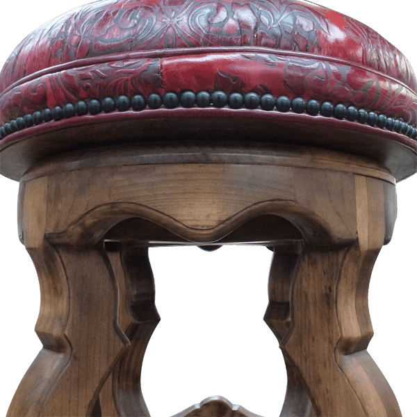 Detail of La Fresa bar stool showing embossed leather seat and wood carvings
