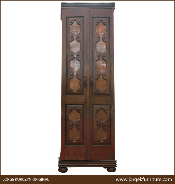 Handcrafted Spanish colonial armoire with copper panels behind carved wood, front view