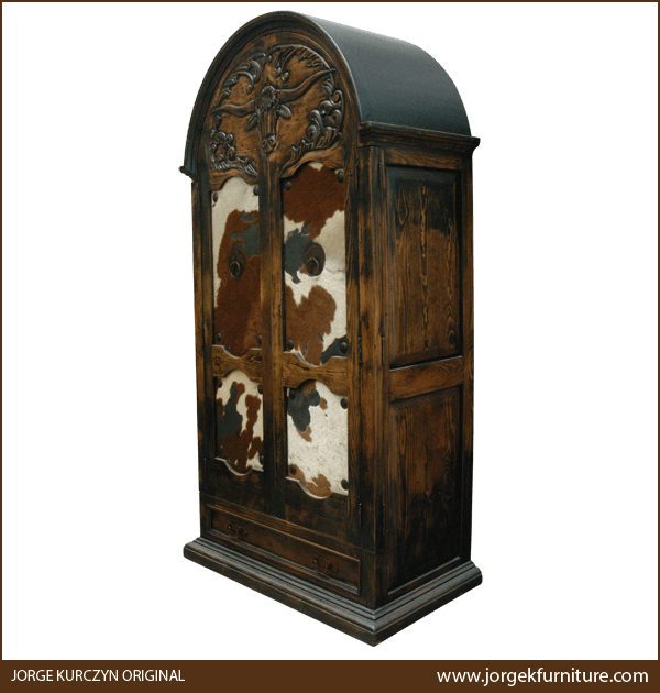 Three-quarter angle of Western armoire showing carved details and molding base