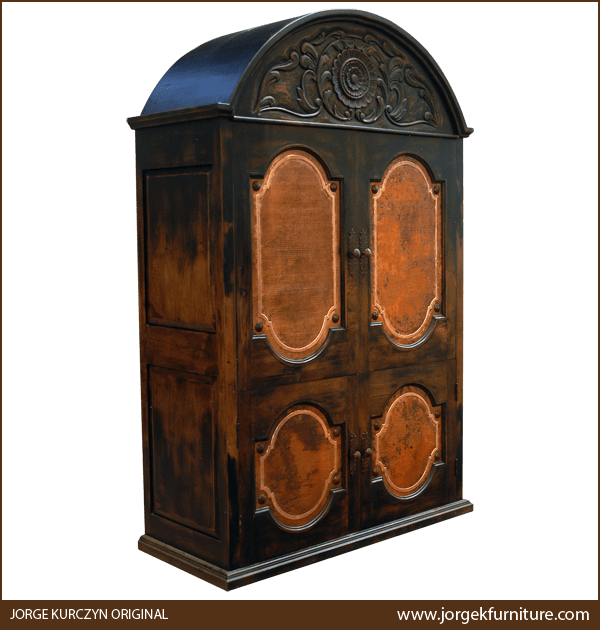 Spanish colonial armoire with hand hammered copper panels and semi-circular carved top, three-quarter view