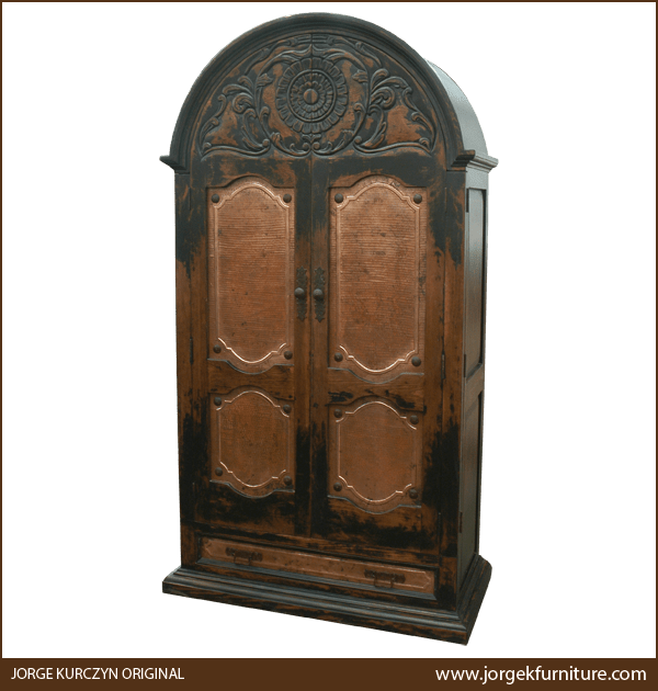 Front view of luxurious Spanish colonial armoire with hand tooled copper panels and carved floral top