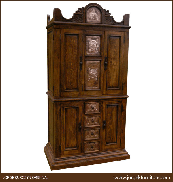 Spanish colonial-style armoire with hand-tooled copper panels, forged iron handles, and solid wood crest, angled view